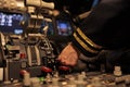 Female copilot pushing dashboard buttons in plane cockpit Royalty Free Stock Photo