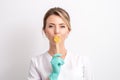 Female cosmetologist holding stick with wax.