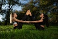 Female couple practicing yoga