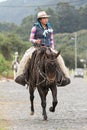 Female cowboy on horse back in Ecuador
