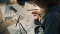 Female creative designer works on storyboard and draws sketches for her project Royalty Free Stock Photo