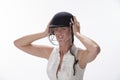 Female cricketer putting on safety helmet