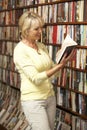 Female customer in bookshop Royalty Free Stock Photo