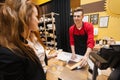 Female customer buying cheese at store