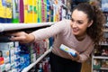 Female customer buying toothpaste Royalty Free Stock Photo