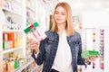 Female customer found medicines in pharmacy Royalty Free Stock Photo