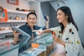 female customer pointing on the digital tablet