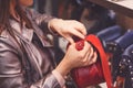 Female customer purchasing new handbag in shop