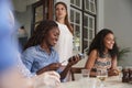 Female Customer In Restaurant Paying Bill Using Contactless Credit Card Terminal Royalty Free Stock Photo