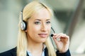 Female customer service representative on hands free device Royalty Free Stock Photo