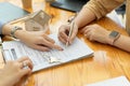 Female customer signing house insurance contract from real estate agent Royalty Free Stock Photo