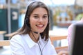 Female customer support operator with headset and smiling. Royalty Free Stock Photo