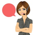 Female customer support phone operator with arms crossed and speech bubble Royalty Free Stock Photo