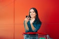 Happy Woman Checking Shopping List on Her Smartphone Royalty Free Stock Photo