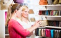 Female customers in store shopping looking for wallets and purse Royalty Free Stock Photo