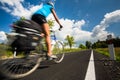 Female cyclist biking on a country road Royalty Free Stock Photo