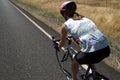 Female Cyclist on Country Road Royalty Free Stock Photo