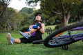 Female cyclist getting injured while falling from mountain bike Royalty Free Stock Photo