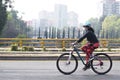 Female cyclist practicing cycling on a bicycle in mexico city on a sunday morning