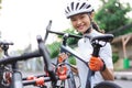 female cyclist unloading her road bicycle on a rack in the back of her car Royalty Free Stock Photo