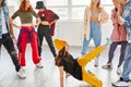 female dance teacher recording a new dance video in studio with pupils Royalty Free Stock Photo