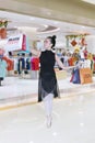 Female dancer carrying Black Friday text in mall