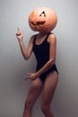 Female dancer with halloweens pumpkin