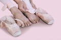 Female dancer taking off ballet shoes after dancing Royalty Free Stock Photo