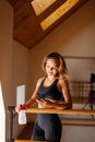 Female dancer using phone by mirror