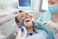 Female dentis working with patient at dental clinic office Royalty Free Stock Photo