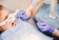 Pediatric dentist examining child teeth with dental explorer and mirror. Royalty Free Stock Photo