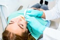 Female dentist checking up patient teeth with braces at dental clinic office. Medicine, dentistry concept. Dental Royalty Free Stock Photo
