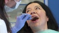 Dentist checks up woman`s teeth