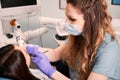 Female dentist examining patient teeth in dental clinic. Royalty Free Stock Photo