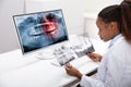 Dentist Examining Teeth X-ray On Computer Royalty Free Stock Photo