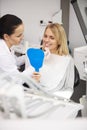 Female dentist examining woman`s teeth during dental checkup Royalty Free Stock Photo