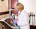 Female dentist and little girl patient