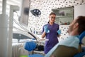 Female dentist with patient in dental chair Royalty Free Stock Photo