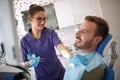 Dentist preparing patient for dental treatment