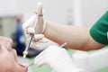 Female dentist provides dental anesthesia