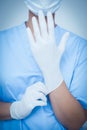 Female dentist wearing surgical glove