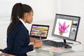 Female Designer Drawing Flower On Computer Using Graphic Tablet Royalty Free Stock Photo