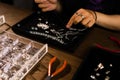 Female designer making jewelries at a jewelry shop Royalty Free Stock Photo