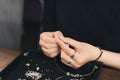 Female designer making jewelries at a jewelry shop o