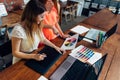 Female designer working with client at desk in her office Royalty Free Stock Photo