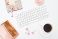 Female desk and accessories on a white background. Styled image
