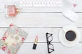 Female desktop with accessories on white wooden background
