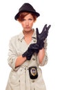 Female Detective with Badge Putting on Gloves