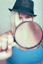 Female detective with magnifying glass Royalty Free Stock Photo