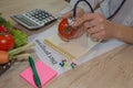 Female Dietician Examining Fresh Vegetables With Stethoscope Royalty Free Stock Photo